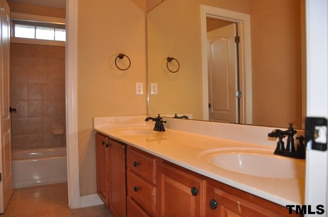 4019 Fenn Brook Lane Raleigh, NC 27613 - Photo 17 of 25 Upstairs tiled hall bath with double sinks, new faucets, separate tub/shower and toilet Hall Bath