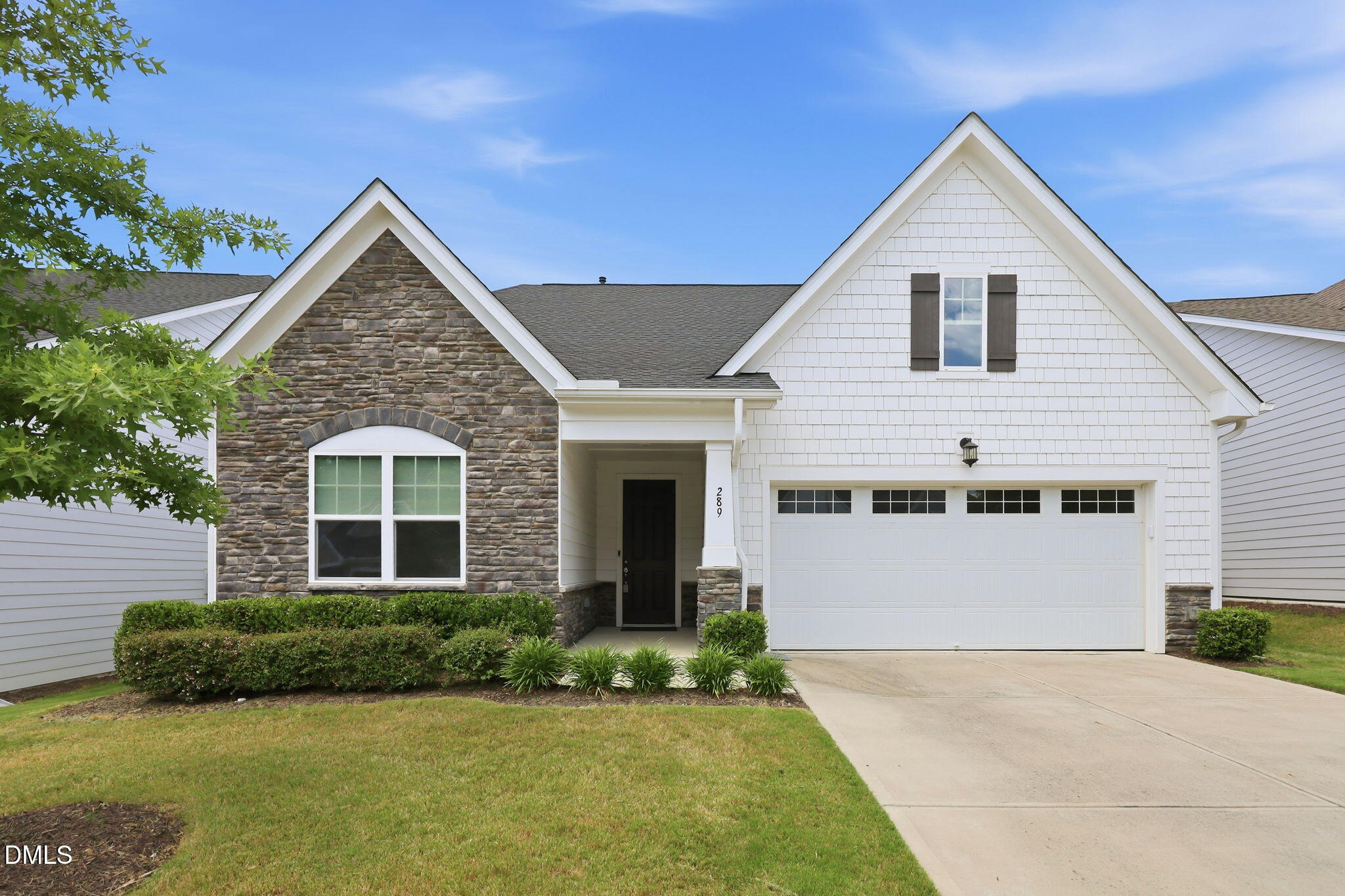 289 English Violet Lane Raleigh, NC 27610 - Photo 1 of 40 a front view of a house with a yard and garage
