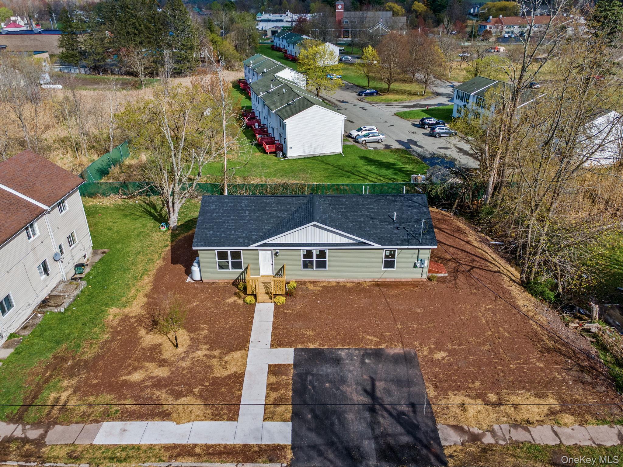 23 Spring Street Monticello, NY 12701 - Photo 6 of 44 a aerial view of a house