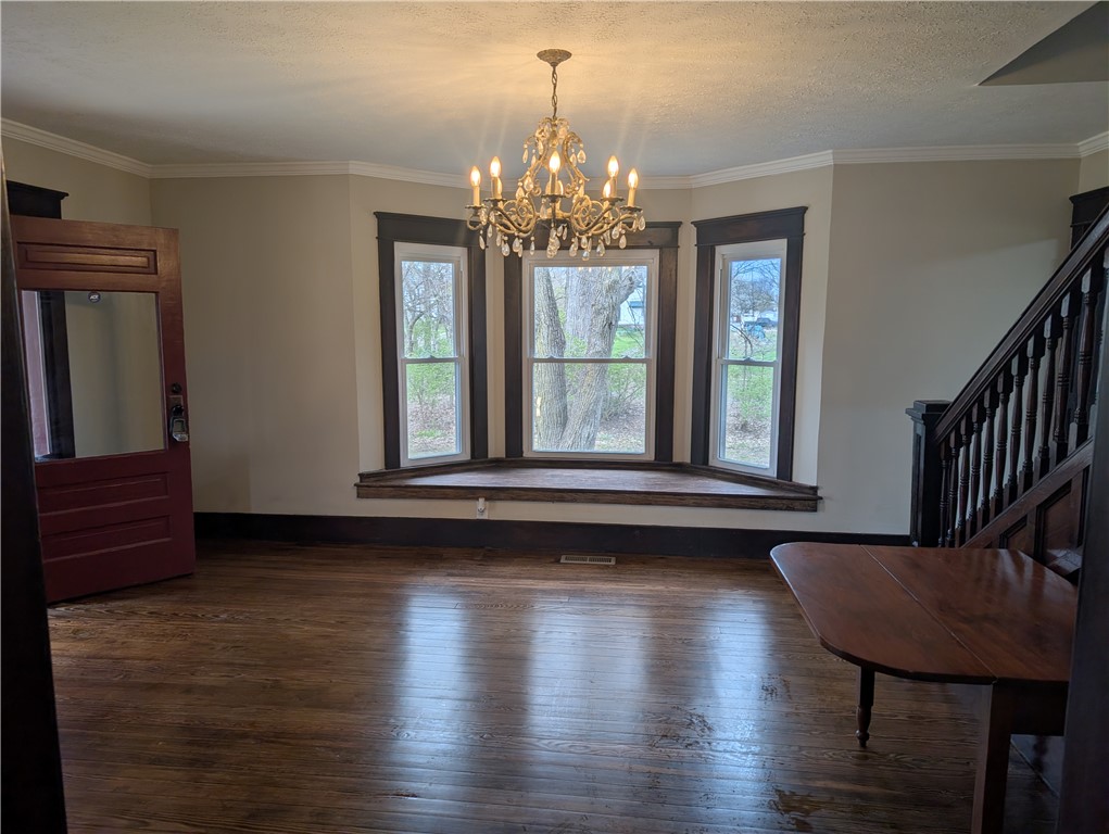 10796 Preble County Line Road Brookville, OH 45309 - Photo 7 of 33 This living space features hardwood flooring and a stunning bay window.