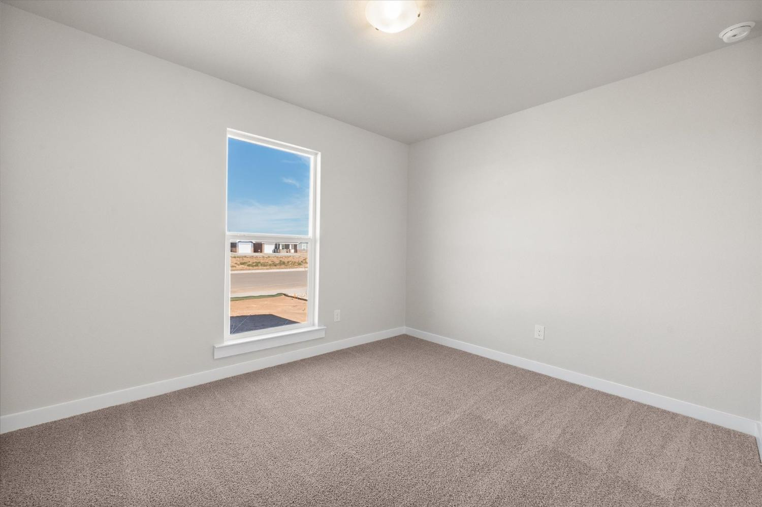 5519 Queens Street Lubbock, TX 79416 - Photo 8 of 21 an empty room with windows