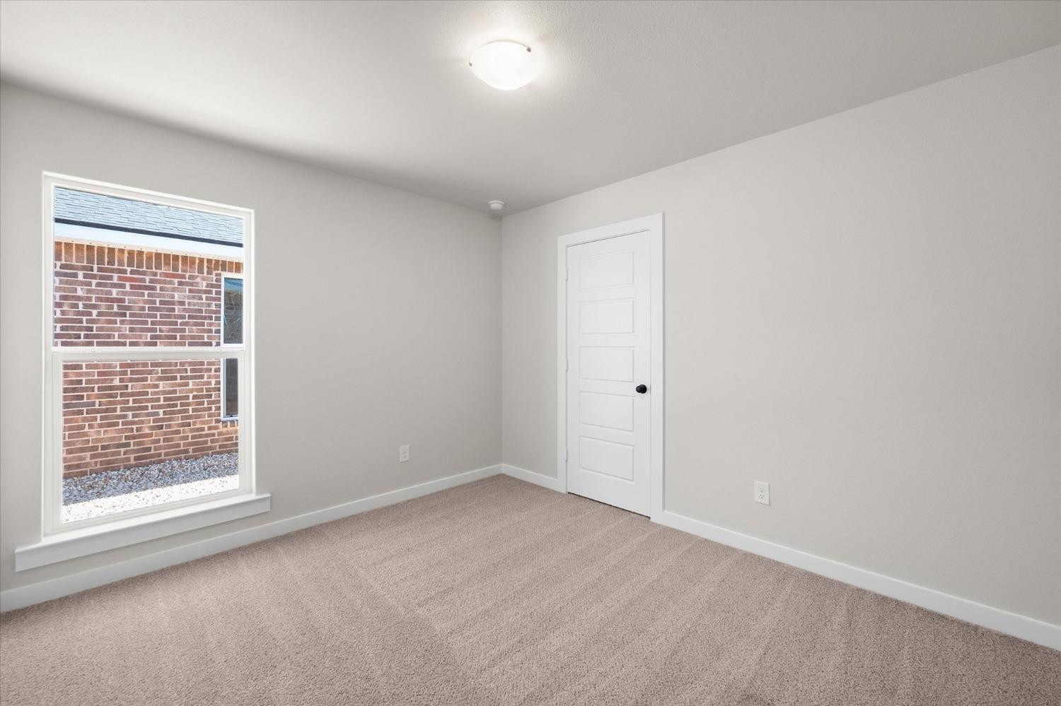 5519 Queens Street Lubbock, TX 79416 - Photo 10 of 21 an empty room with a window