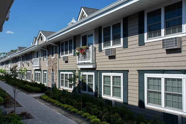 333 Candee Avenue, Unit H5 Sayville, NY 11782 - Photo 1 of 5 a house view with a garden space