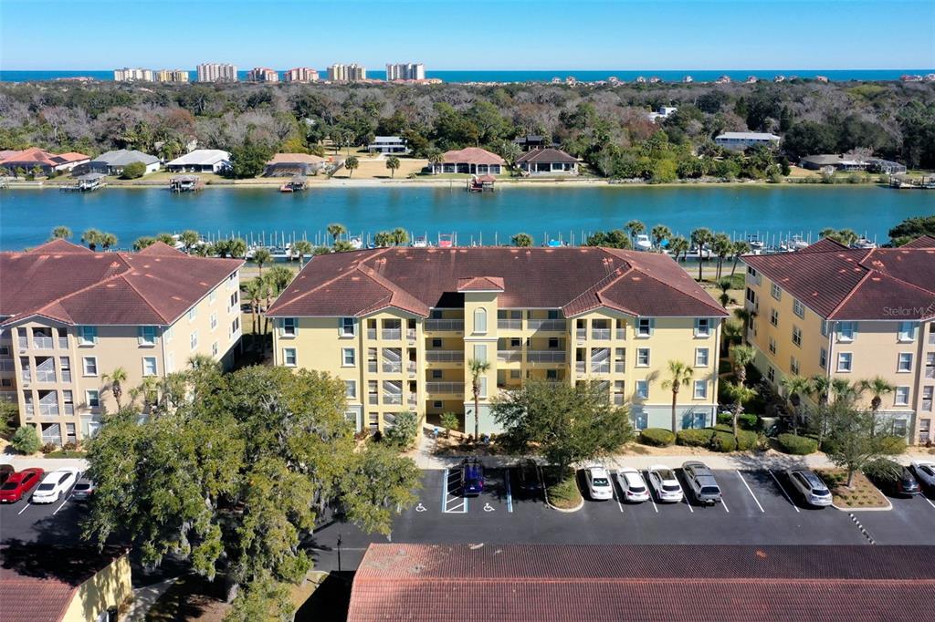 700 Canopy Walk Lane, Unit 735 Palm Coast, FL 32137 - Photo 1 of 77 an aerial view of a house with lake view and mountain view