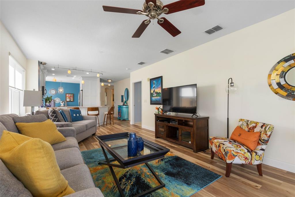 700 Canopy Walk Lane, Unit 735 Palm Coast, FL 32137 - Photo 15 of 77 a living room with furniture and a flat screen tv