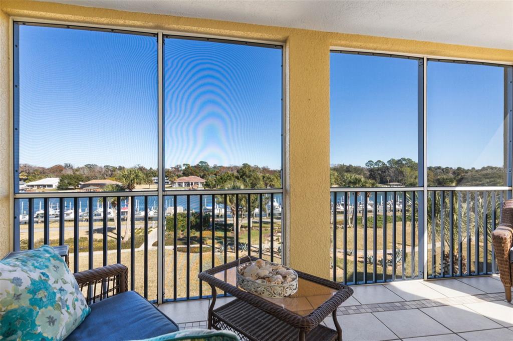 700 Canopy Walk Lane, Unit 735 Palm Coast, FL 32137 - Photo 25 of 77 a view of a balcony with wooden floor