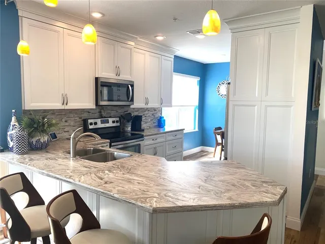 a view of storage and utility room with a window