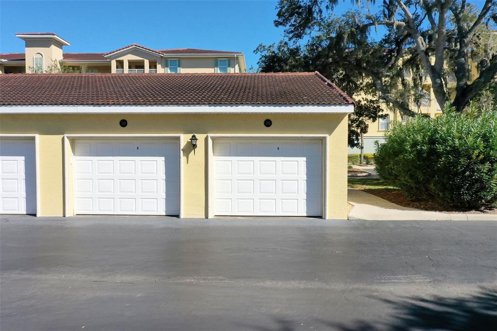 700 Canopy Walk Lane, Unit 735 Palm Coast, FL 32137 - Photo 45 of 77 a front view of a house with a yard and garage