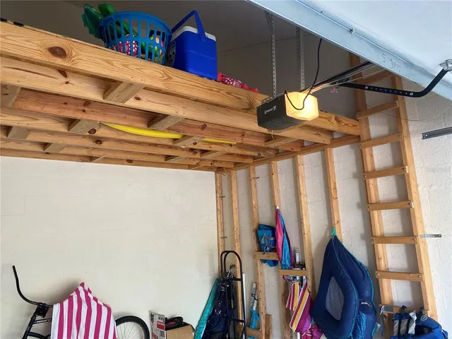 an aerial view of a houses with a lake view