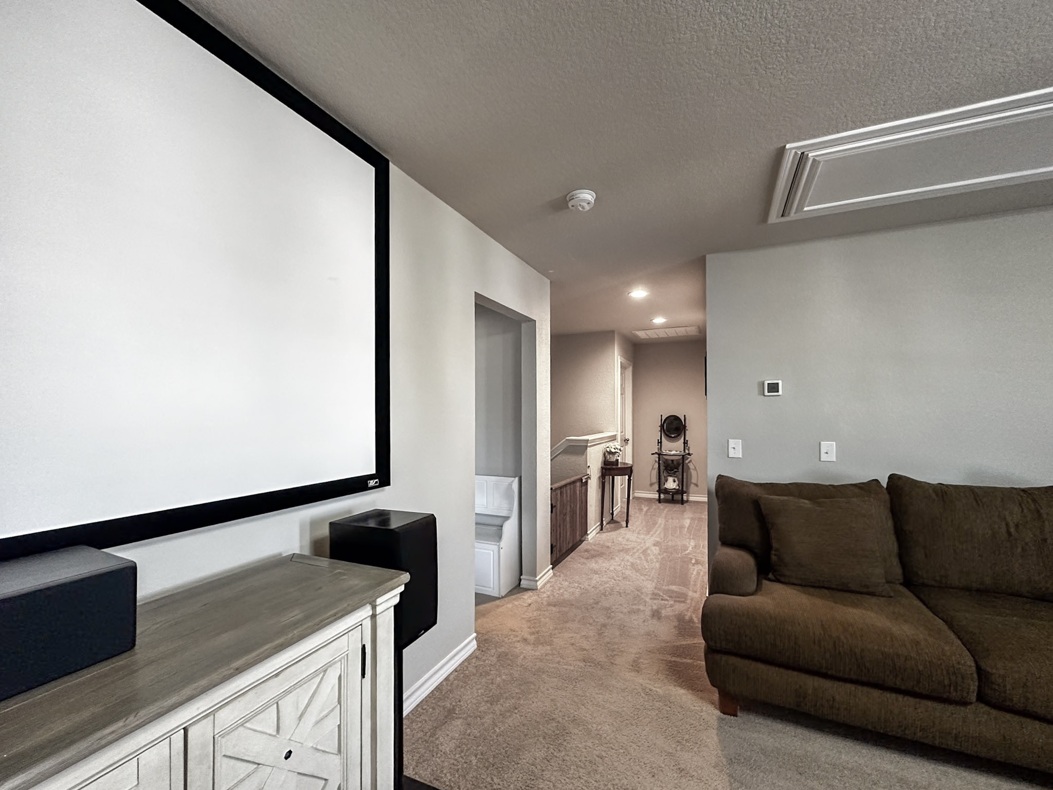 11005 Players Path Austin, TX 78747 - Photo 13 of 40 Cinema room with light colored carpet, a textured ceiling, and recessed lighting