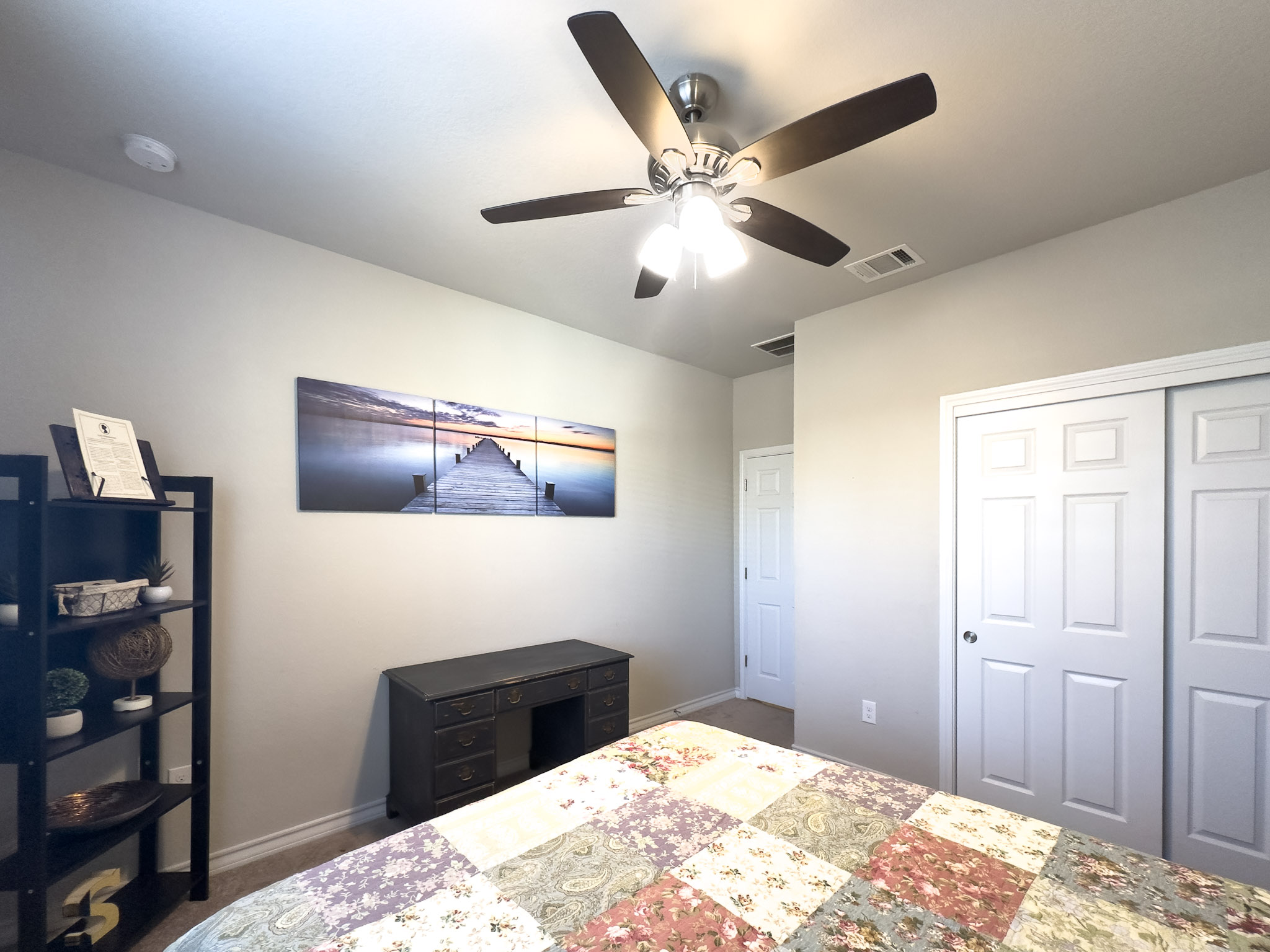 11005 Players Path Austin, TX 78747 - Photo 19 of 40 Bedroom featuring a closet and a ceiling fan