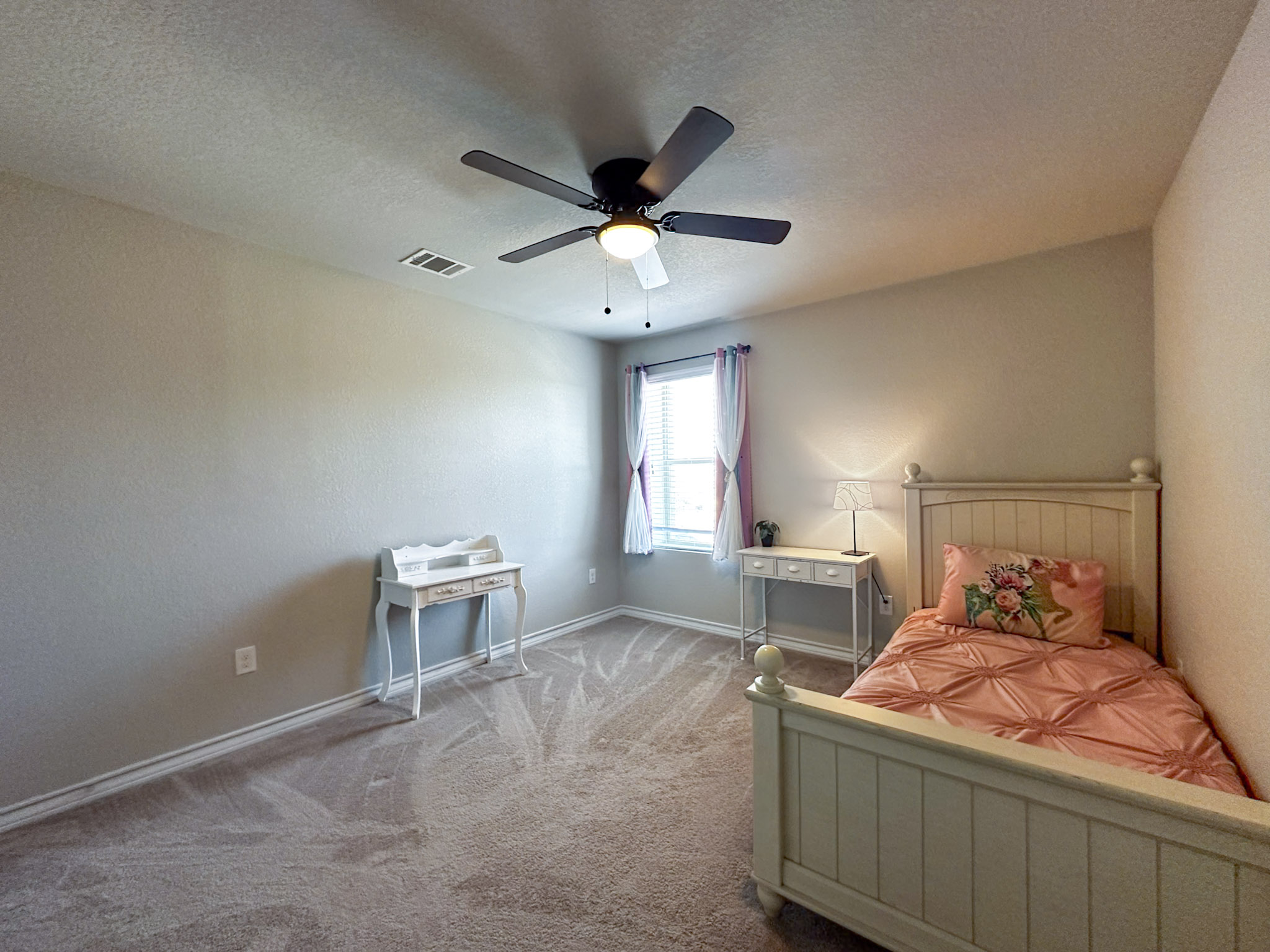 11005 Players Path Austin, TX 78747 - Photo 21 of 40 Bedroom with a textured ceiling, carpet floors, and ceiling fan