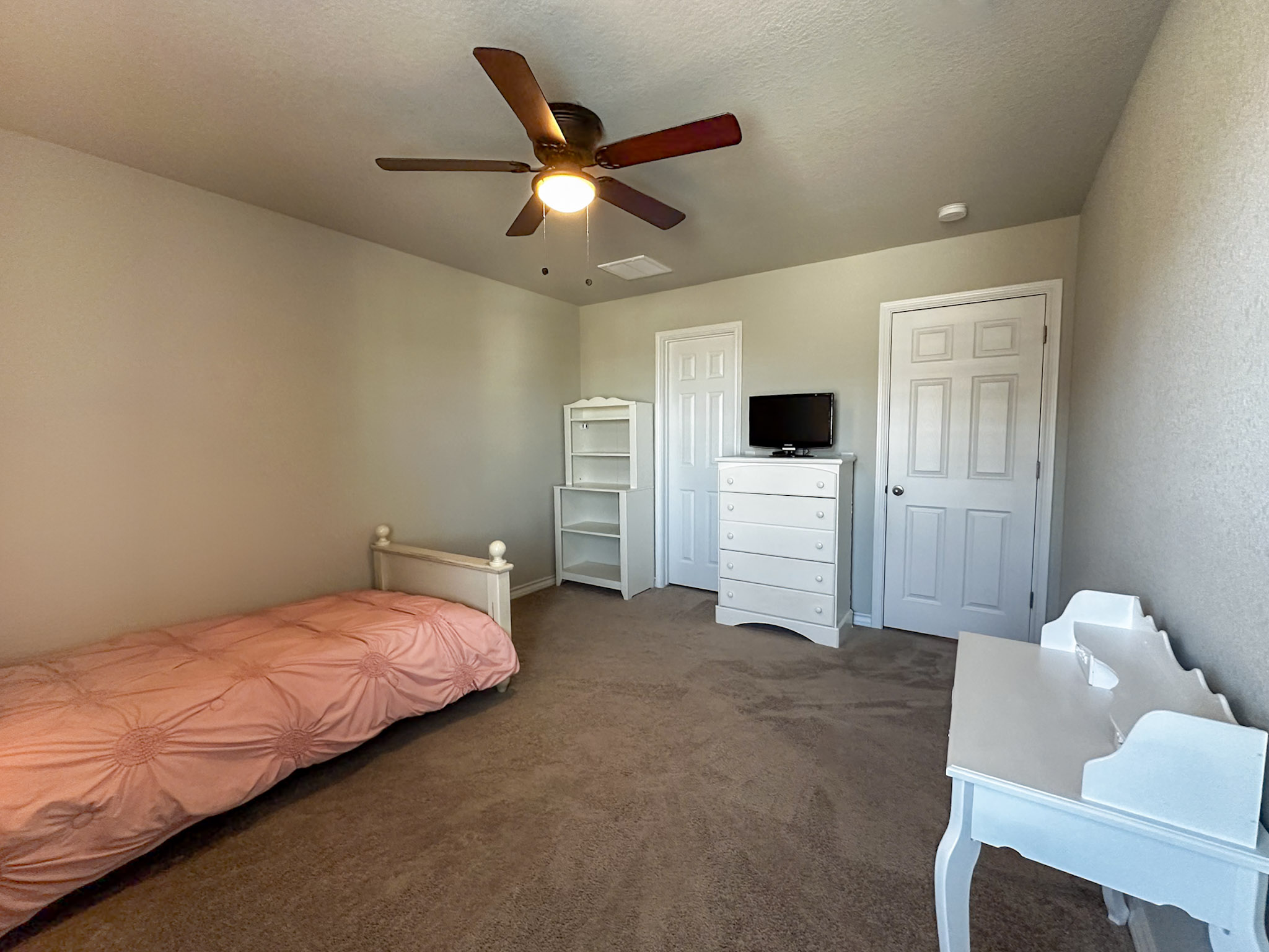 11005 Players Path Austin, TX 78747 - Photo 22 of 40 Bedroom with carpet and a ceiling fan