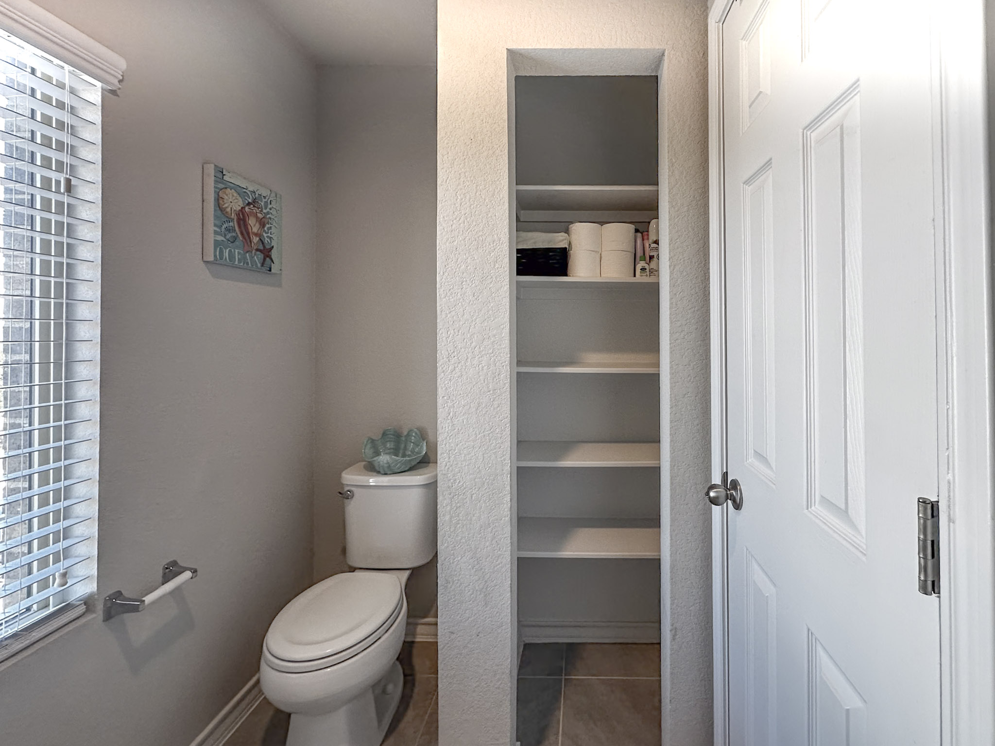 11005 Players Path Austin, TX 78747 - Photo 32 of 40 Bathroom with light tile patterned floors and a textured wall