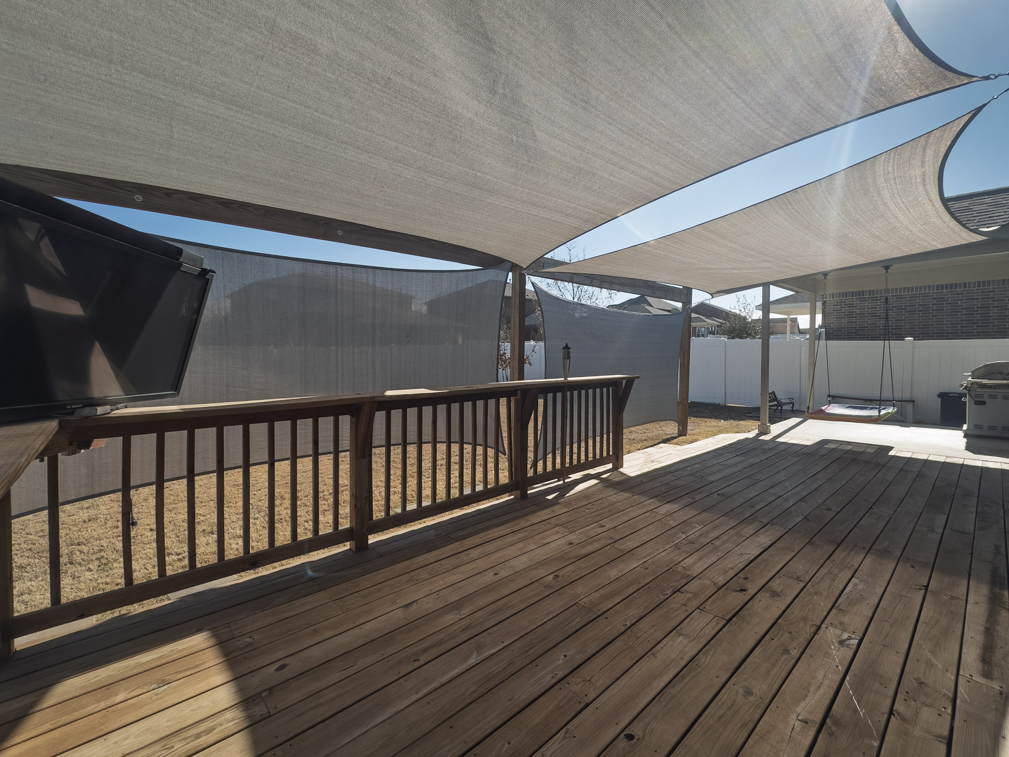 11005 Players Path Austin, TX 78747 - Photo 33 of 40 Wooden deck featuring a grill and a storage shed