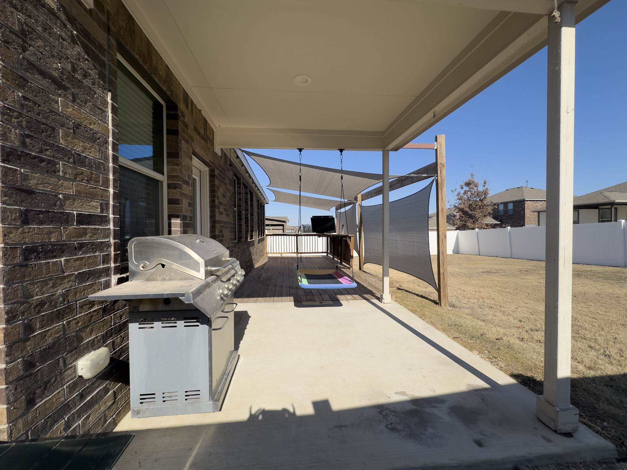 11005 Players Path Austin, TX 78747 - Photo 34 of 40 Fenced backyard featuring a sunroom and area for grilling