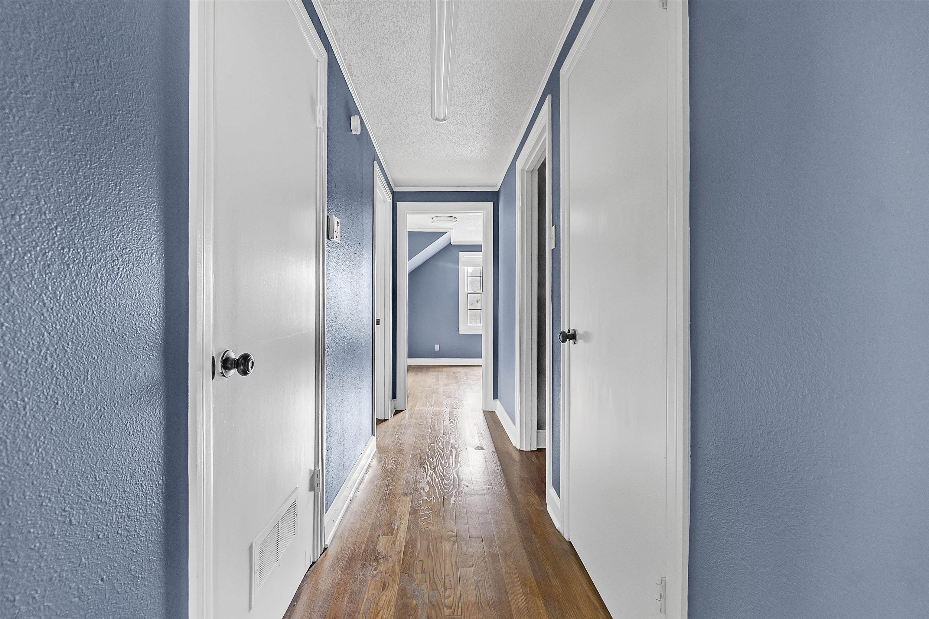3321 Lakeview Road Memphis, TN 38116 - Photo 16 of 30 a view of a hallway with wooden floor and staircase