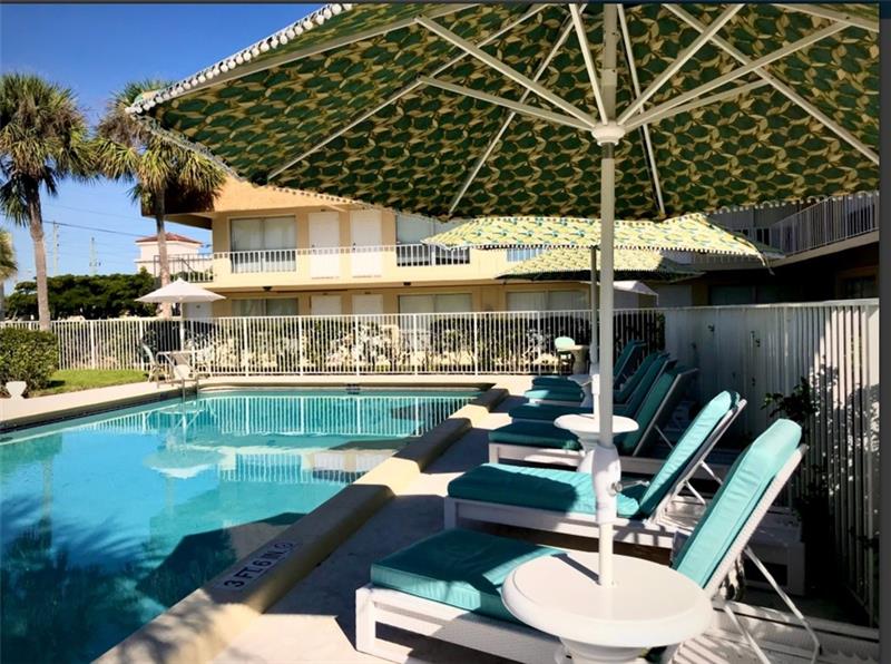 4670 Northeast 5th Avenue, Unit 9 Boca Raton, FL 33431 - Photo 3 of 8 a view of a chairs and table in patio