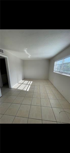 4670 Northeast 5th Avenue, Unit 9 Boca Raton, FL 33431 - Photo 8 of 8 a view of an empty room