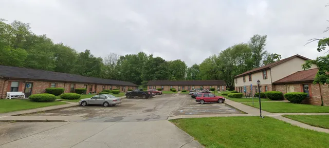 a view of street with parked cars