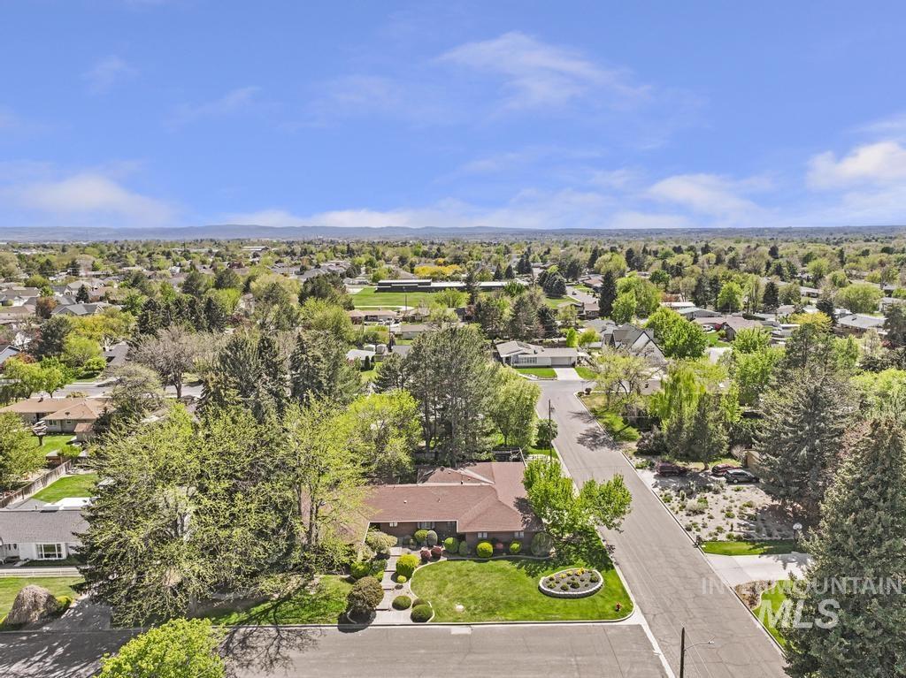 2018 Rancho Vista Drive Twin Falls, ID 83301 - Photo 2 of 50 Aerial perspective showcasing the residential setting with abundant mature trees and verdant landscaping