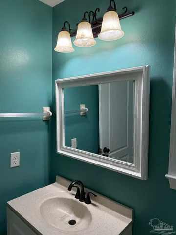 a white toilet sitting next to a bathroom sink and tub
