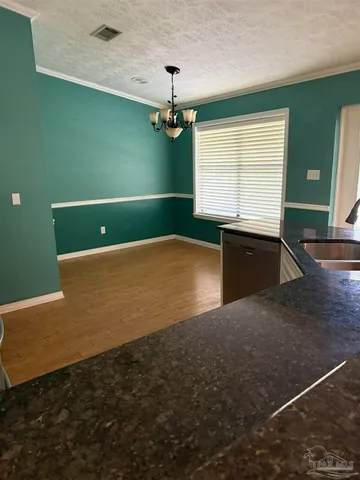 a kitchen with stainless steel appliances a refrigerator a sink a stove and cabinets