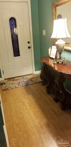 a room with fireplace a fireplace and a chandelier