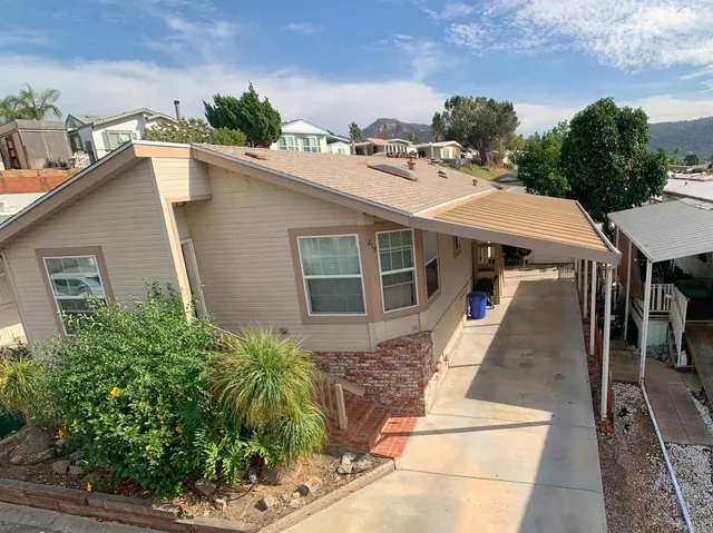 a aerial view of a house with a yard