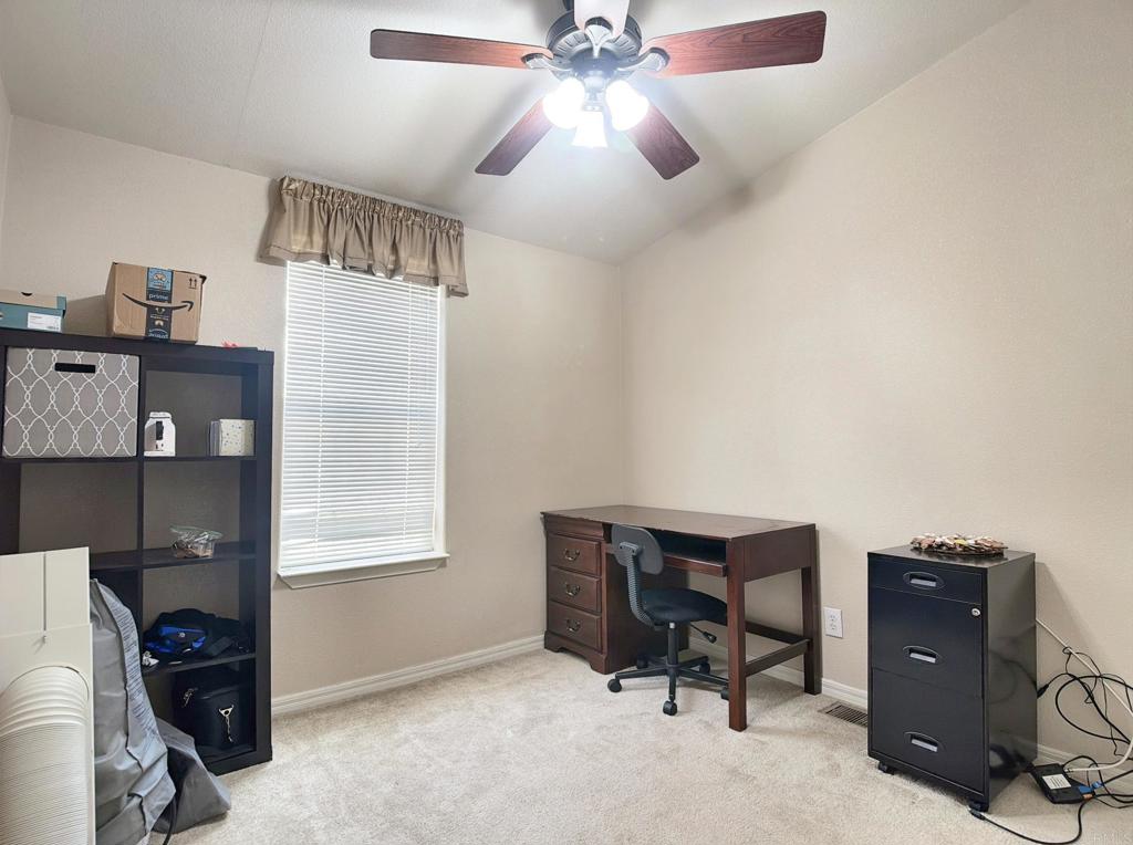 9395 Harritt Road, Unit 215 Lakeside, CA 92040 - Photo 21 of 27 a workspace with furniture and window