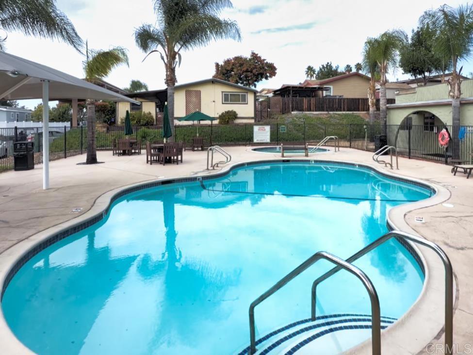 9395 Harritt Road, Unit 215 Lakeside, CA 92040 - Photo 25 of 27 a view of a swimming pool with a patio
