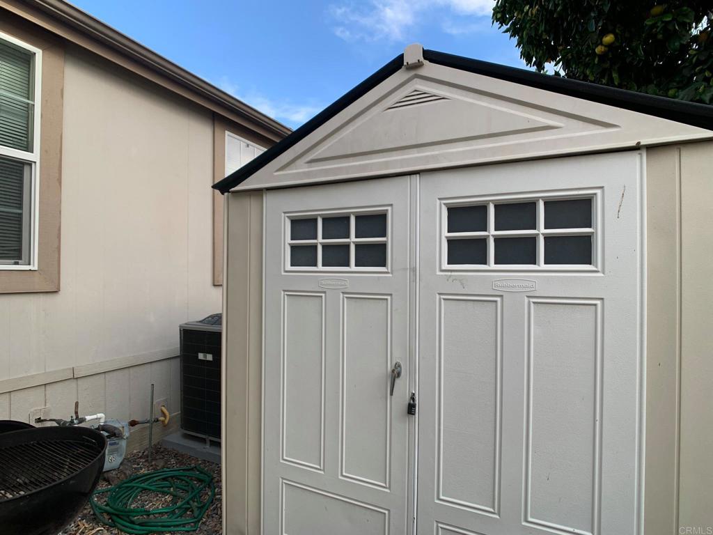 9395 Harritt Road, Unit 215 Lakeside, CA 92040 - Photo 27 of 27 a view of a house with a small backyard