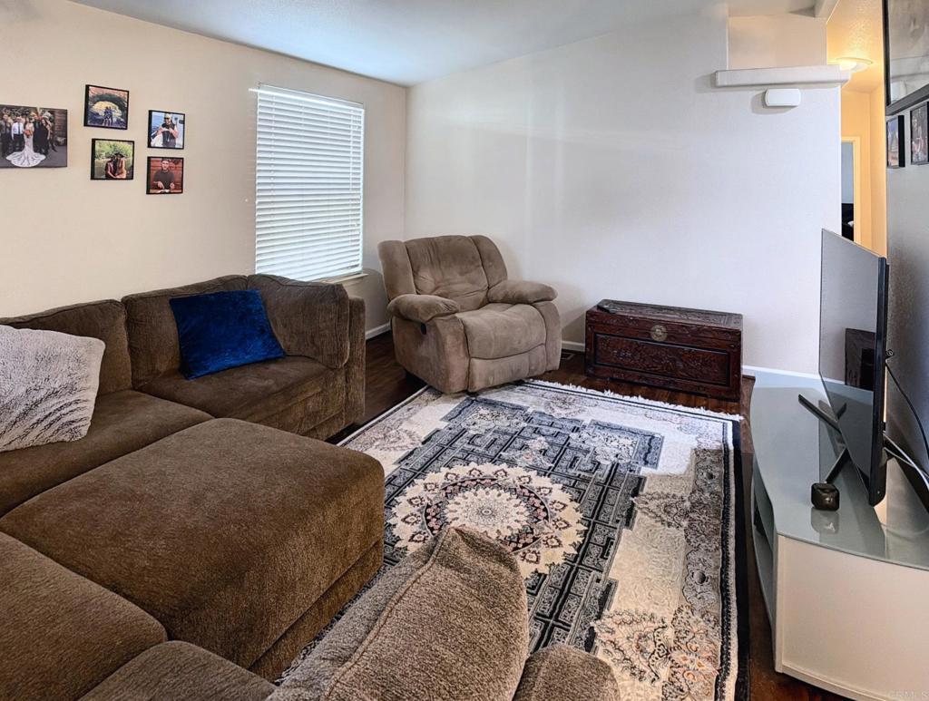 9395 Harritt Road, Unit 215 Lakeside, CA 92040 - Photo 9 of 27 a bedroom with furniture and a window