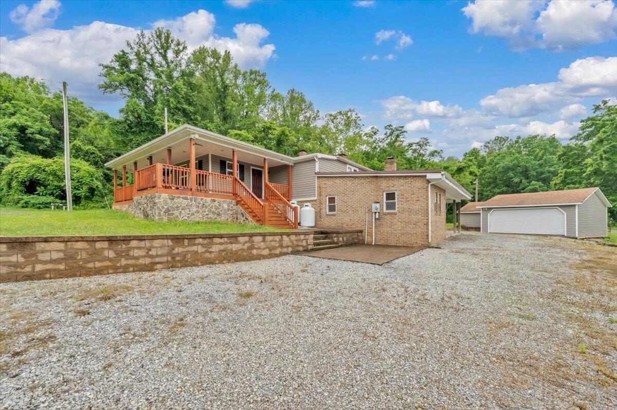 2412 Quarterwood Road Montvale, VA 24122 - Photo 43 of 48 a front view of a house with a yard and garage