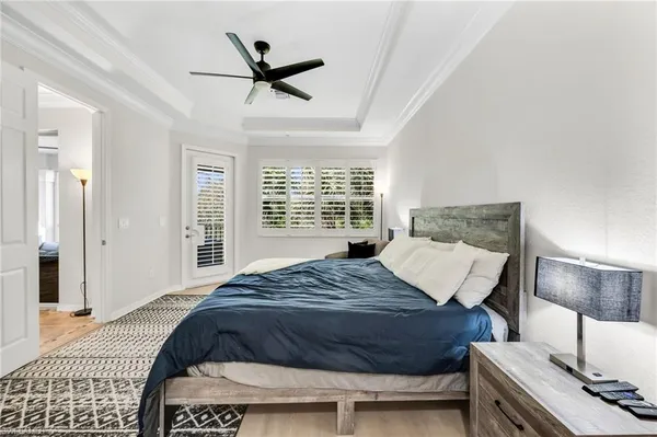 a bedroom with a bed and a lamp