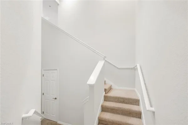 a view of staircase with white walls and white walls