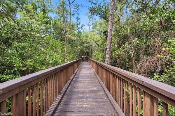 a view of house with outdoor space garden and swimming pool
