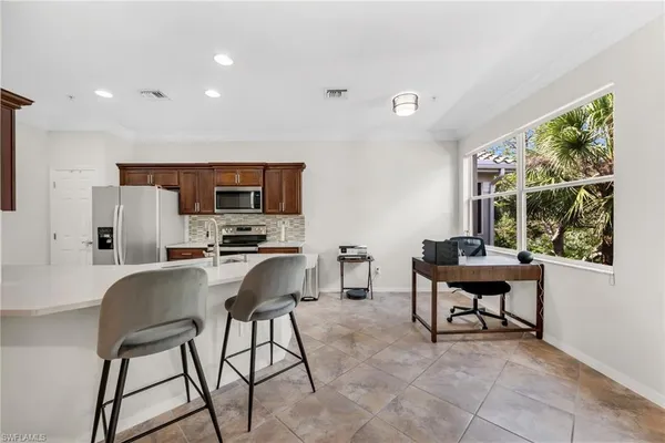 a view of a dining room with furniture window and outside view