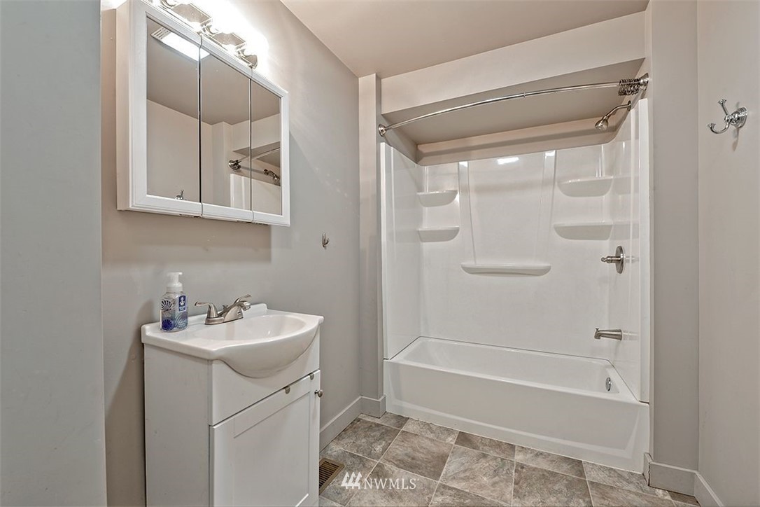 2909 Massey Road Everson, WA 98247 - Photo 17 of 27 a bathroom with a sink a toilet and shower