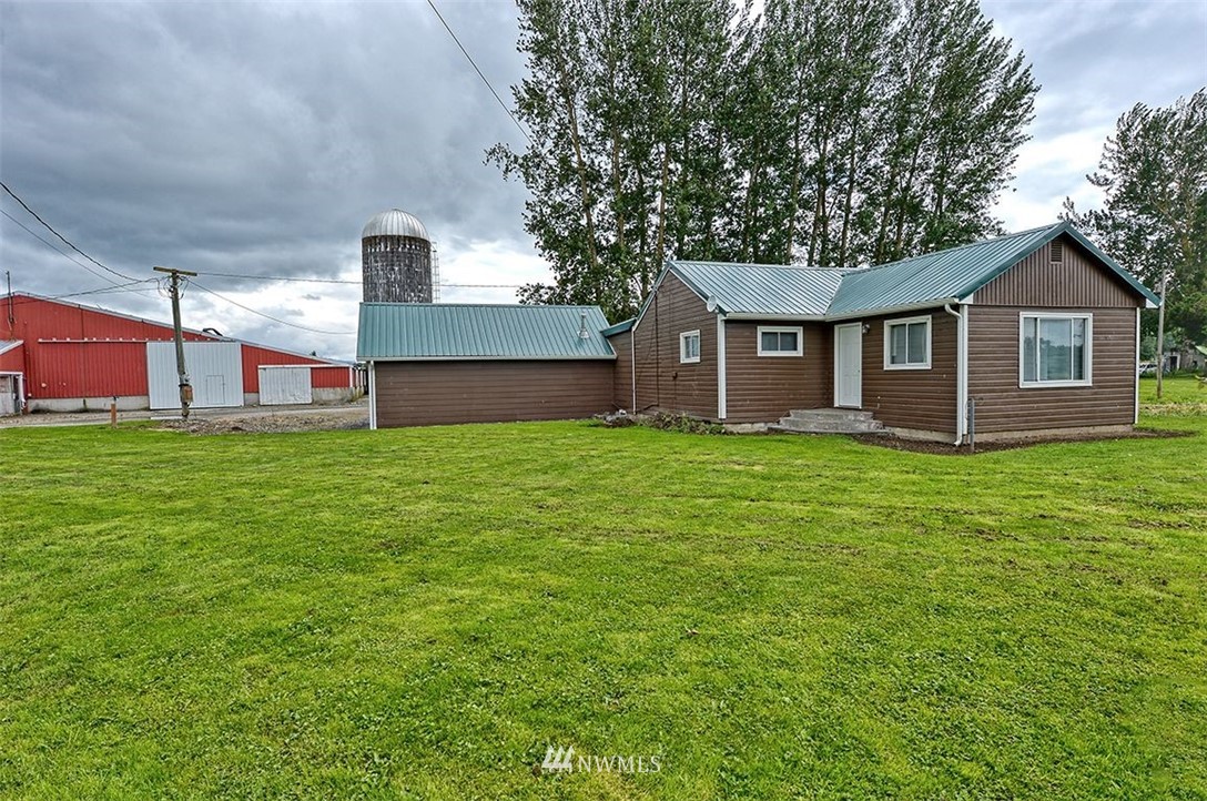 2909 Massey Road Everson, WA 98247 - Photo 6 of 27 a front view of house with yard and trees in the background