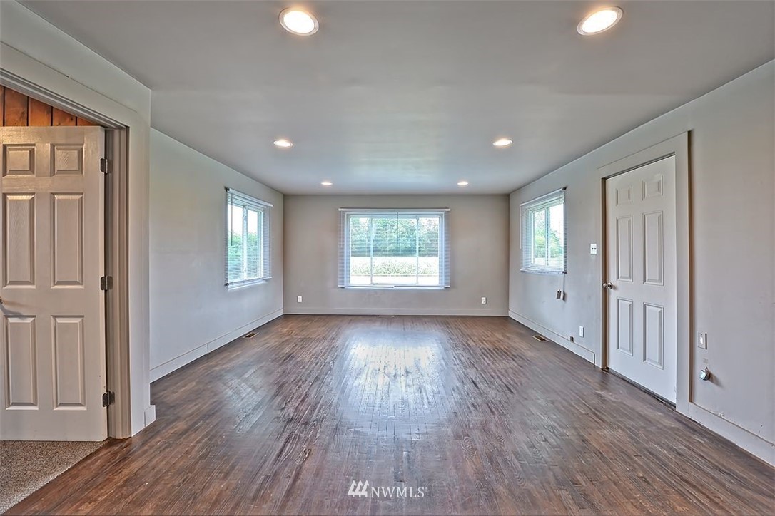 2909 Massey Road Everson, WA 98247 - Photo 9 of 27 a view of an empty room with wooden floor and a window