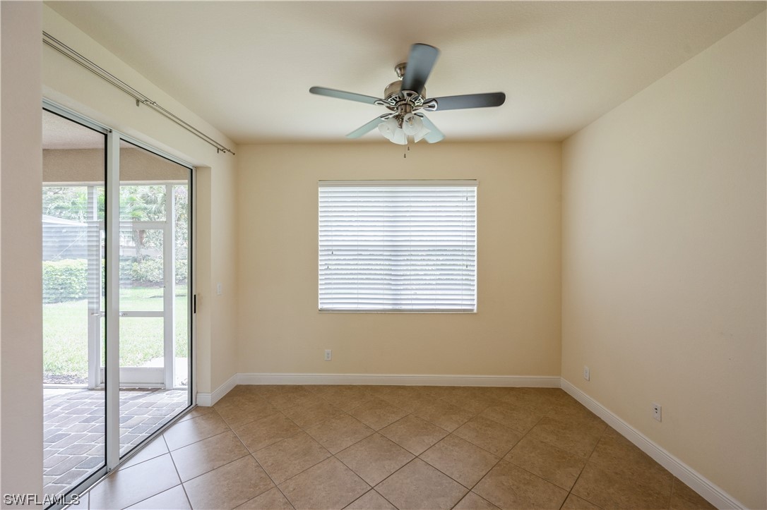 19658 Tesoro Way Estero, FL 33967 - Photo 11 of 25 a view of an empty room with a window