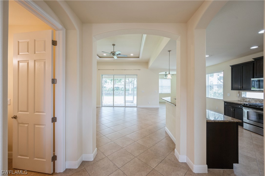 19658 Tesoro Way Estero, FL 33967 - Photo 13 of 25 a view of a kitchen from the hallway