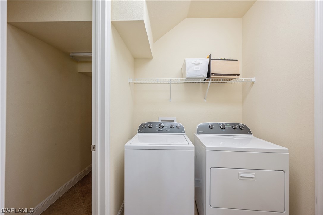 19658 Tesoro Way Estero, FL 33967 - Photo 17 of 25 a utility room with dryer and washer