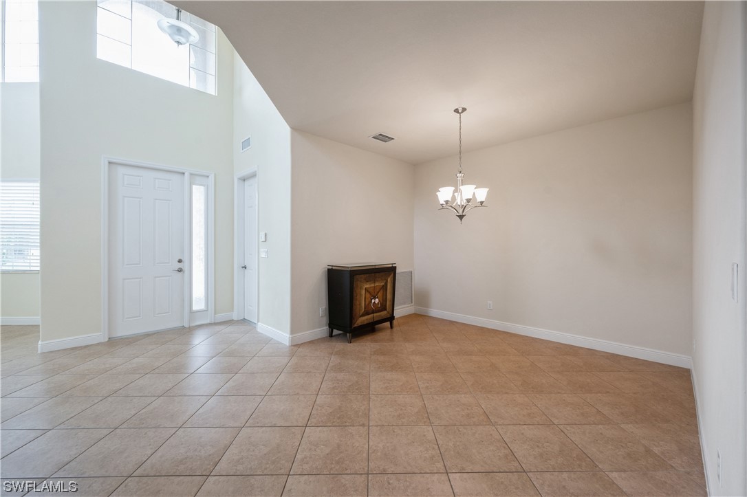19658 Tesoro Way Estero, FL 33967 - Photo 4 of 25 a view of an empty room with a window