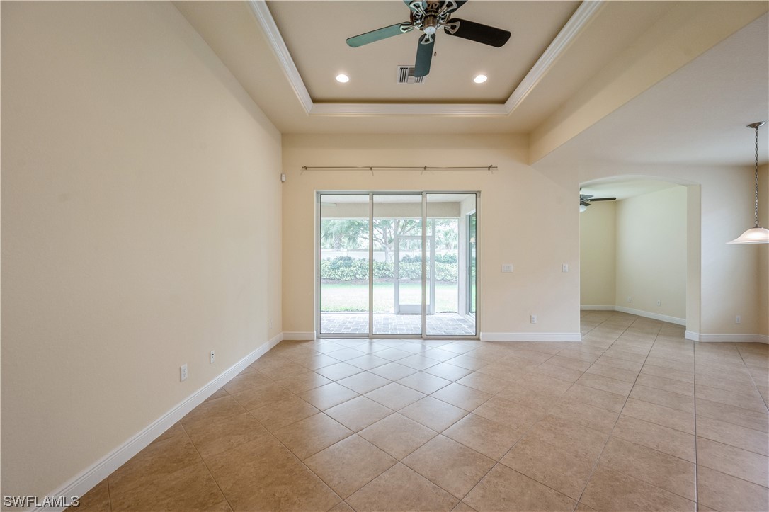 19658 Tesoro Way Estero, FL 33967 - Photo 6 of 25 a view of an empty room with a window