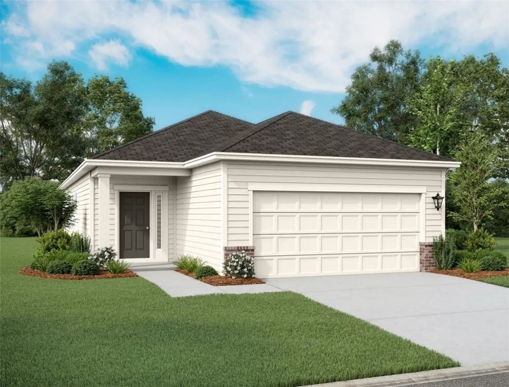 a front view of a house with a garden and plants