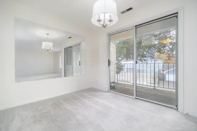 a view of an empty room with a sliding door