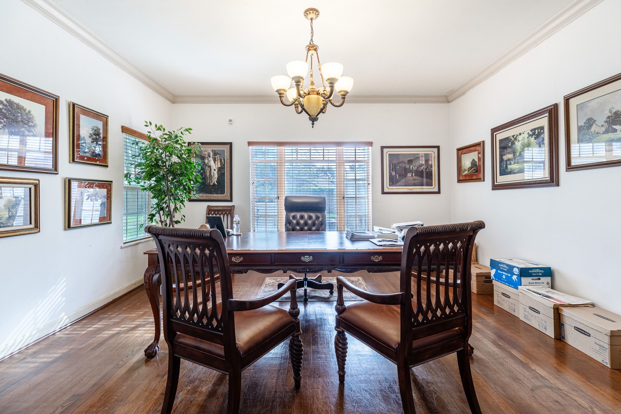 3620 South MacGregor Way Houston, TX 77021 - Photo 3 of 21 a view of a dining room with furniture a chandelier and wooden floor