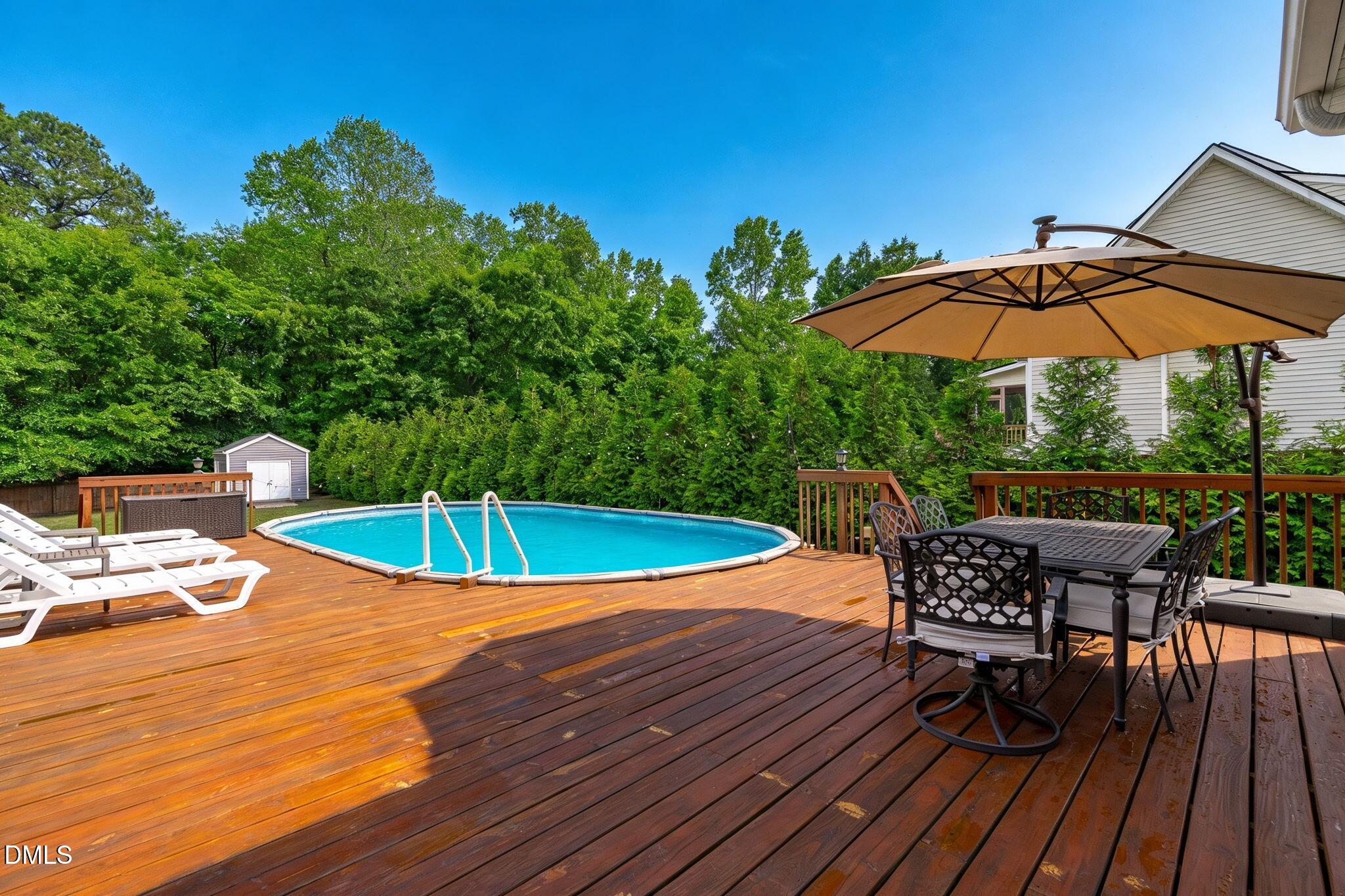 2450 Rolling Tracks Road Willow Spring, NC 27592 - Photo 46 of 64 a view of a swimming pool with a patio